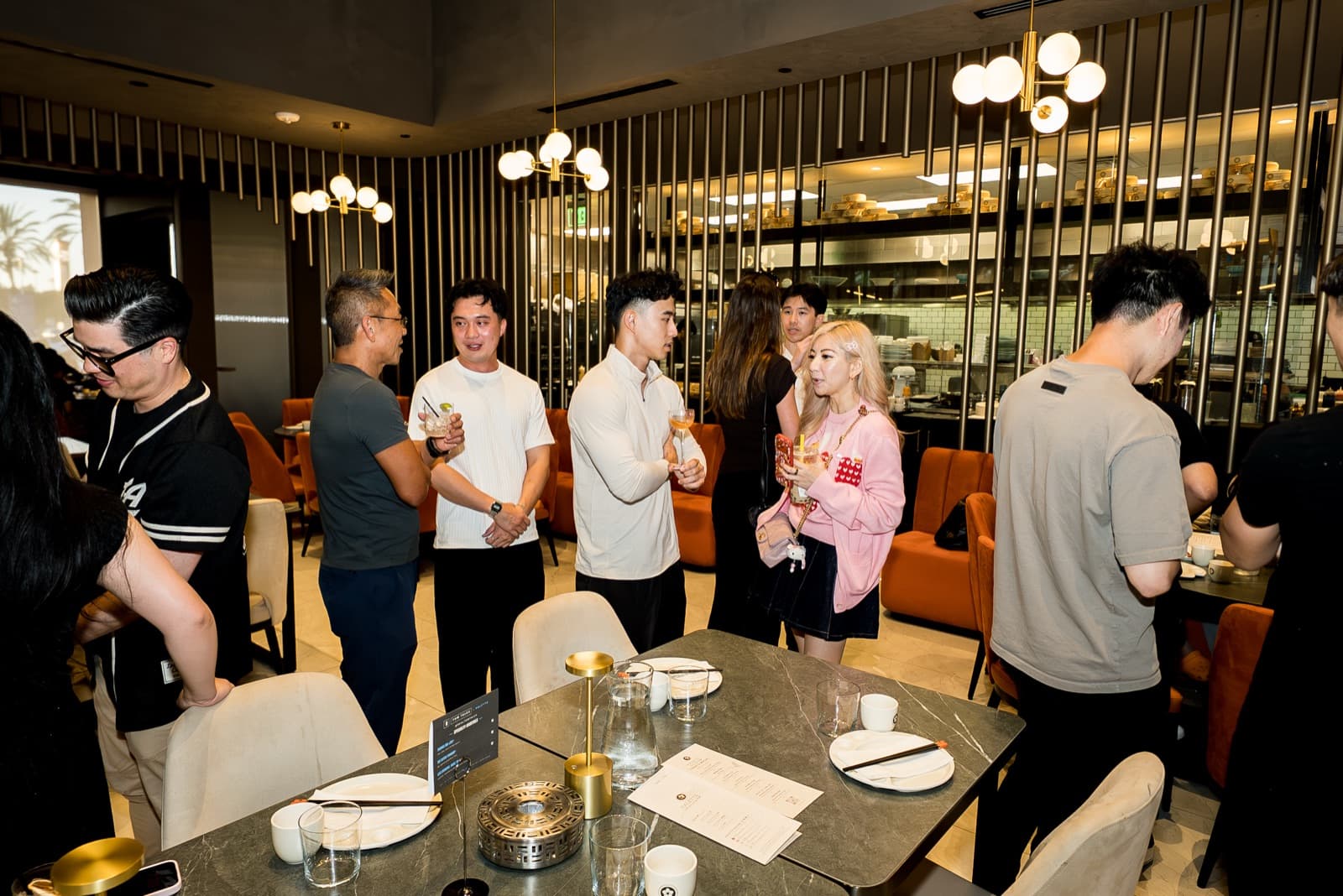 Operators talking over drinks at a Tom Talks gathering